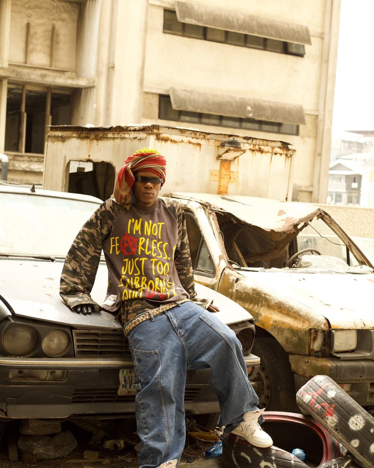 The Fearless Sweatshirt worn beside an abandoned car